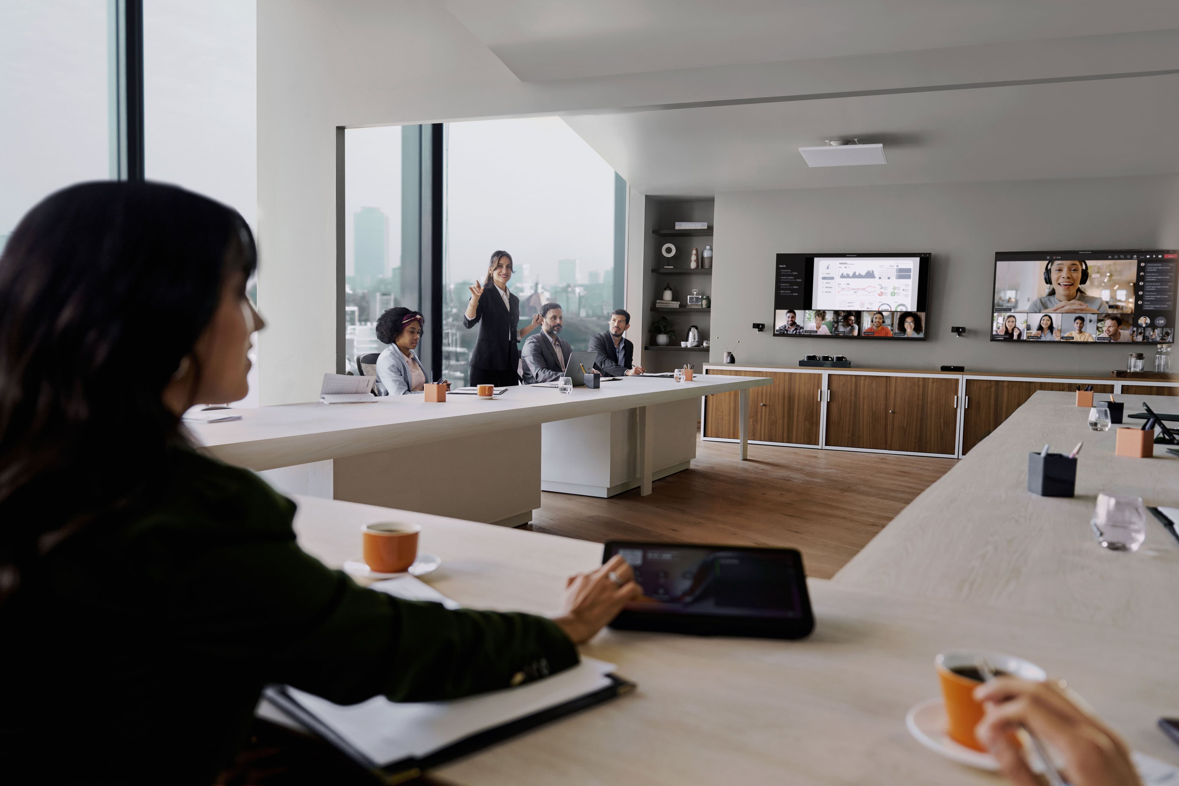 Meeting room with Shure IntelliMix Room Kit and Huddly Crew