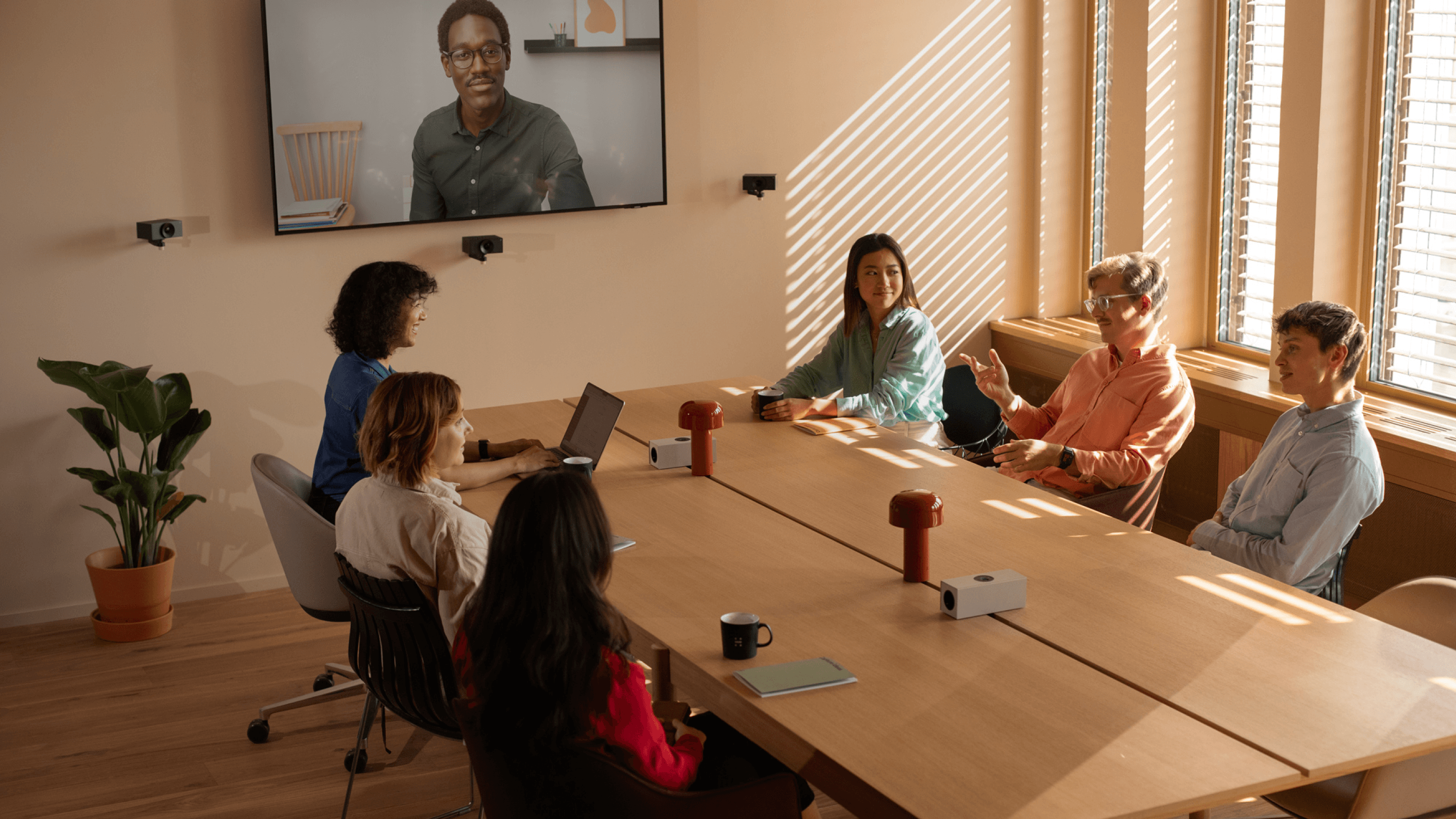 People in a video meeting using Huddly Crew.